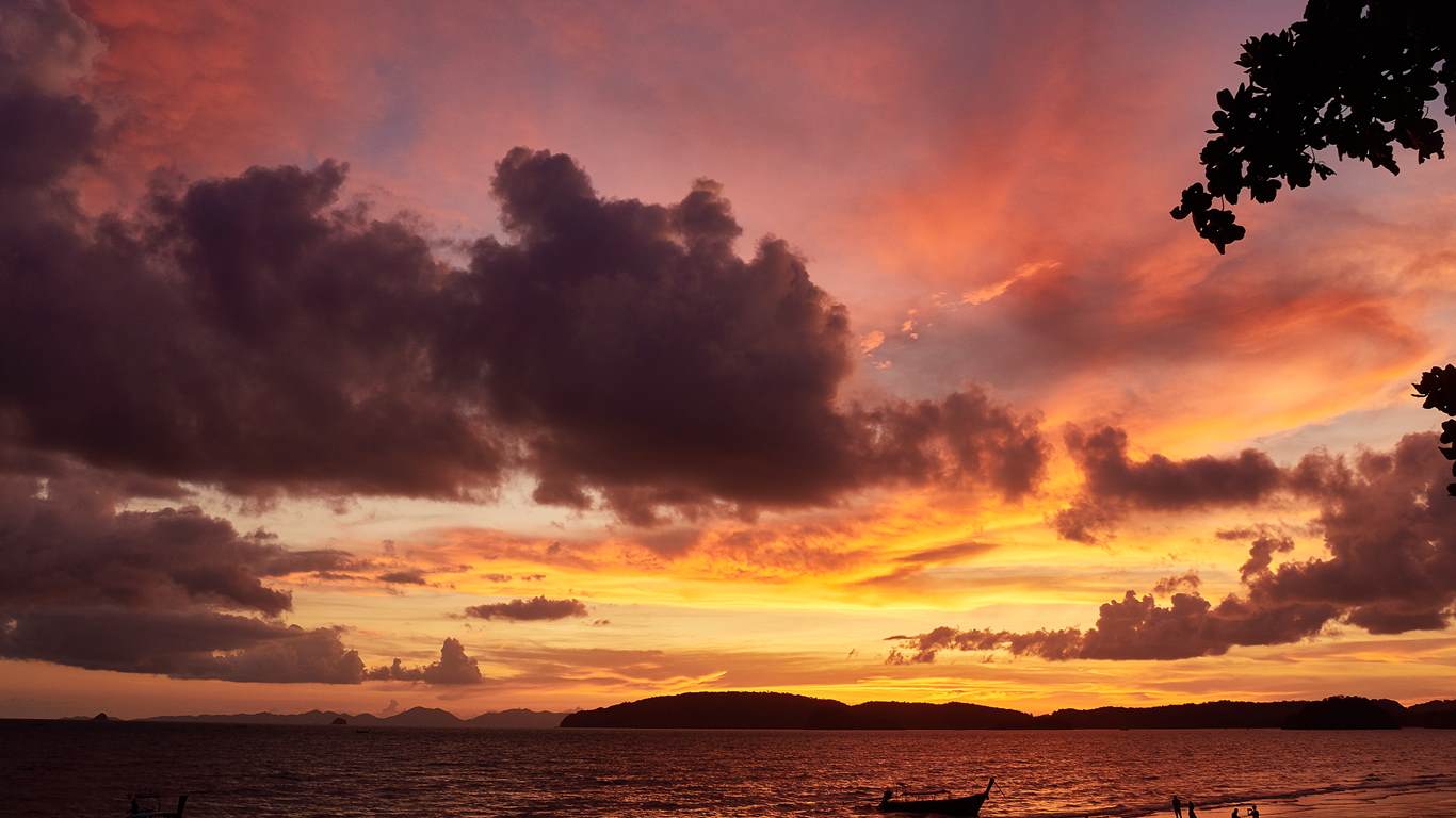 Krabi sunset from beach, island and boat view